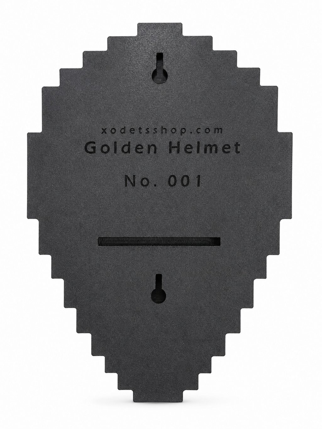 A dark gray, pixelated helmet-shaped black backplate with a slot cutout, featuring the text 'xodetsshop.com Golden Helmet No. 001