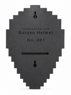 A dark gray, pixelated helmet-shaped black backplate with a slot cutout, featuring the text 'xodetsshop.com Golden Helmet No. 001
