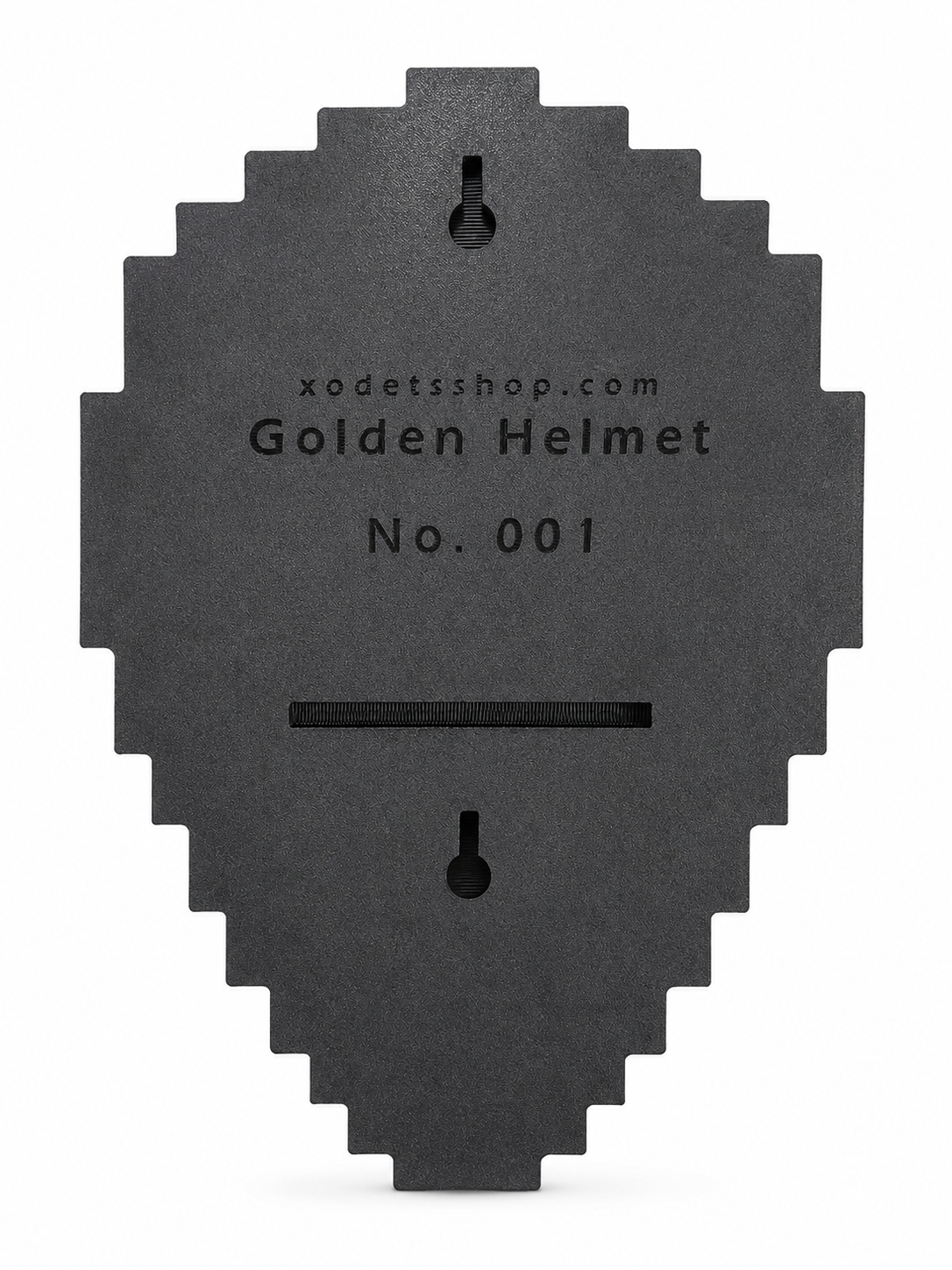 A dark gray, pixelated helmet-shaped black backplate with a slot cutout, featuring the text 'xodetsshop.com Golden Helmet No. 001